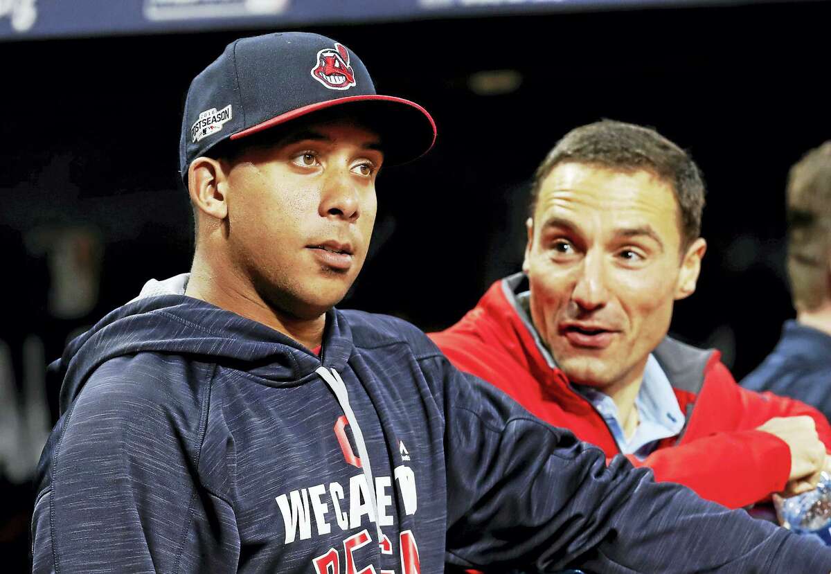 Cleveland Indians team president Chris Antonetti, right, talks with Michael Brantley during practice before Game 1 of the American League Division Series this year.