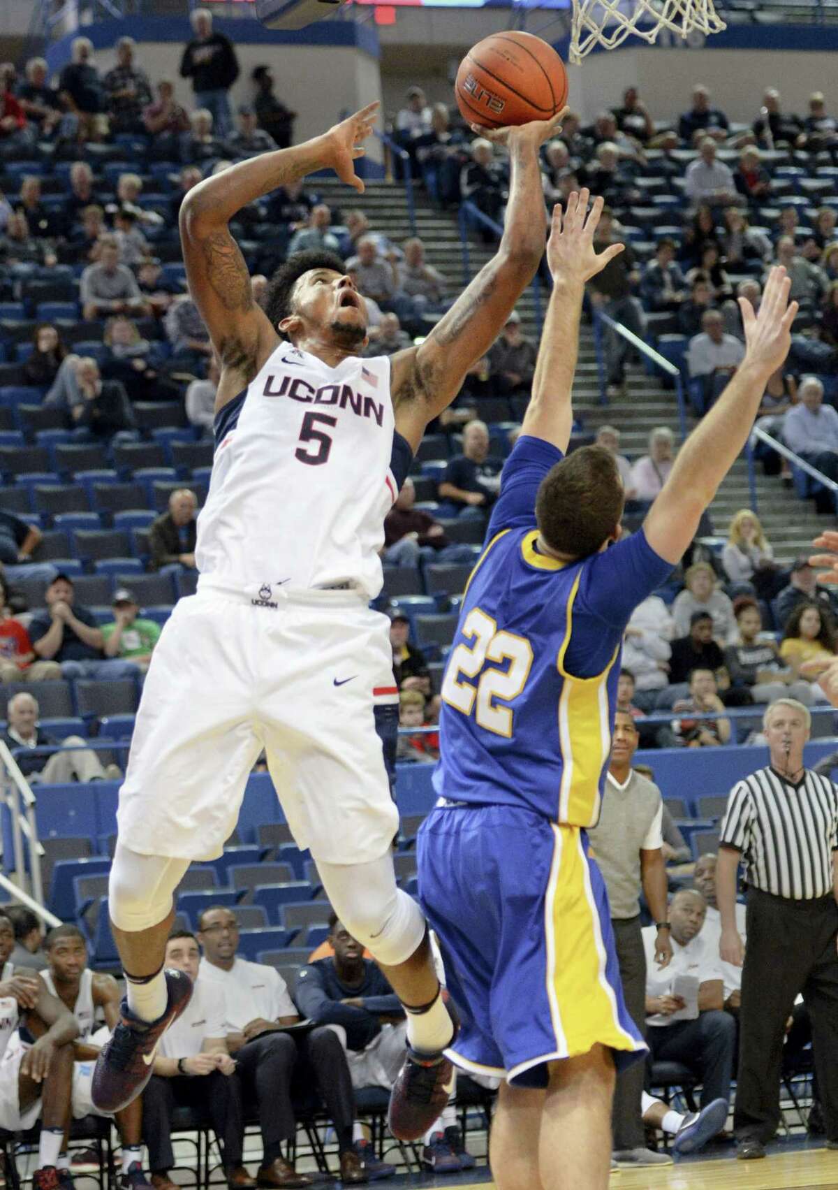 UConn’s Vance Jackson shoots over New Haven’s Tommy Hunt during the second half on Sunday.