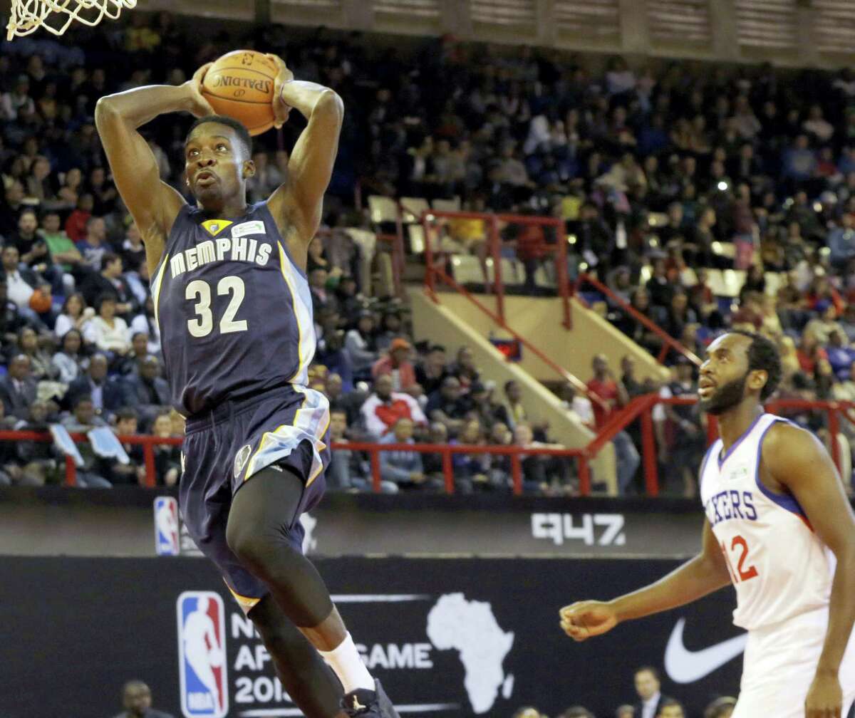 In this Aug. 1, 2015 photo, Team World’s Jeff Green of Memphis Grizzlies, left, goes up for a shot as Team Africa’s Luc Mbah a Moute from Cameroon looks on during the NBA Africa Game at Ellis Park Arena in Johannesburg, South Africa. The NBA will open an academy in Africa in 2017, its latest move to unearth talent from outside the United States and extend the league’s reach into new territories.