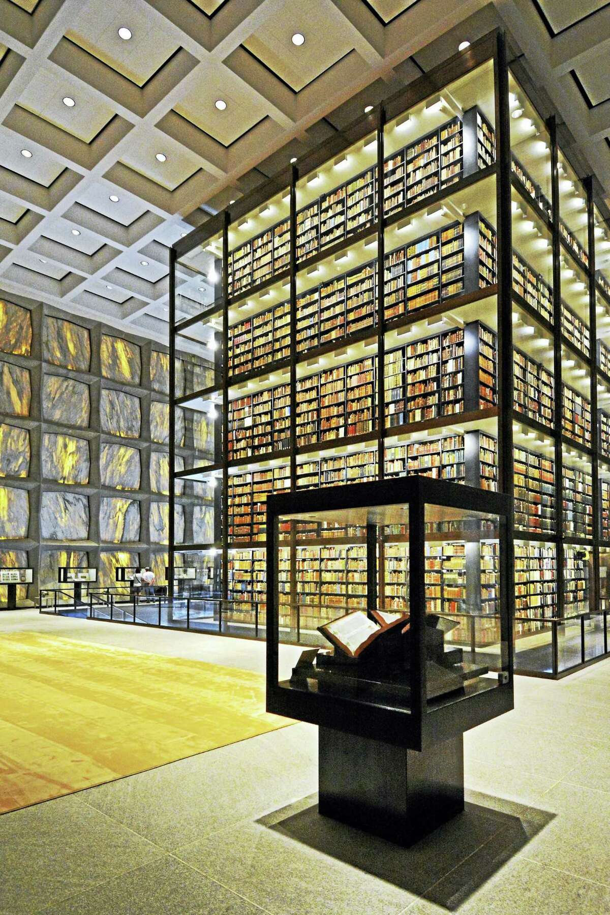Restored and renovated Beinecke Rare Book and Manuscript Library, with exhibition cases surrounding the stacks and translucent marble wall panels.