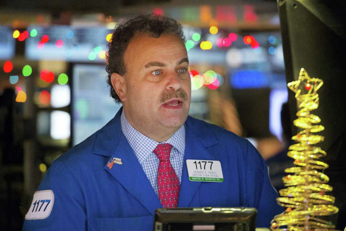 Gerard Farco follows stock prices at the New York Stock Exchange Wednesday in New York.