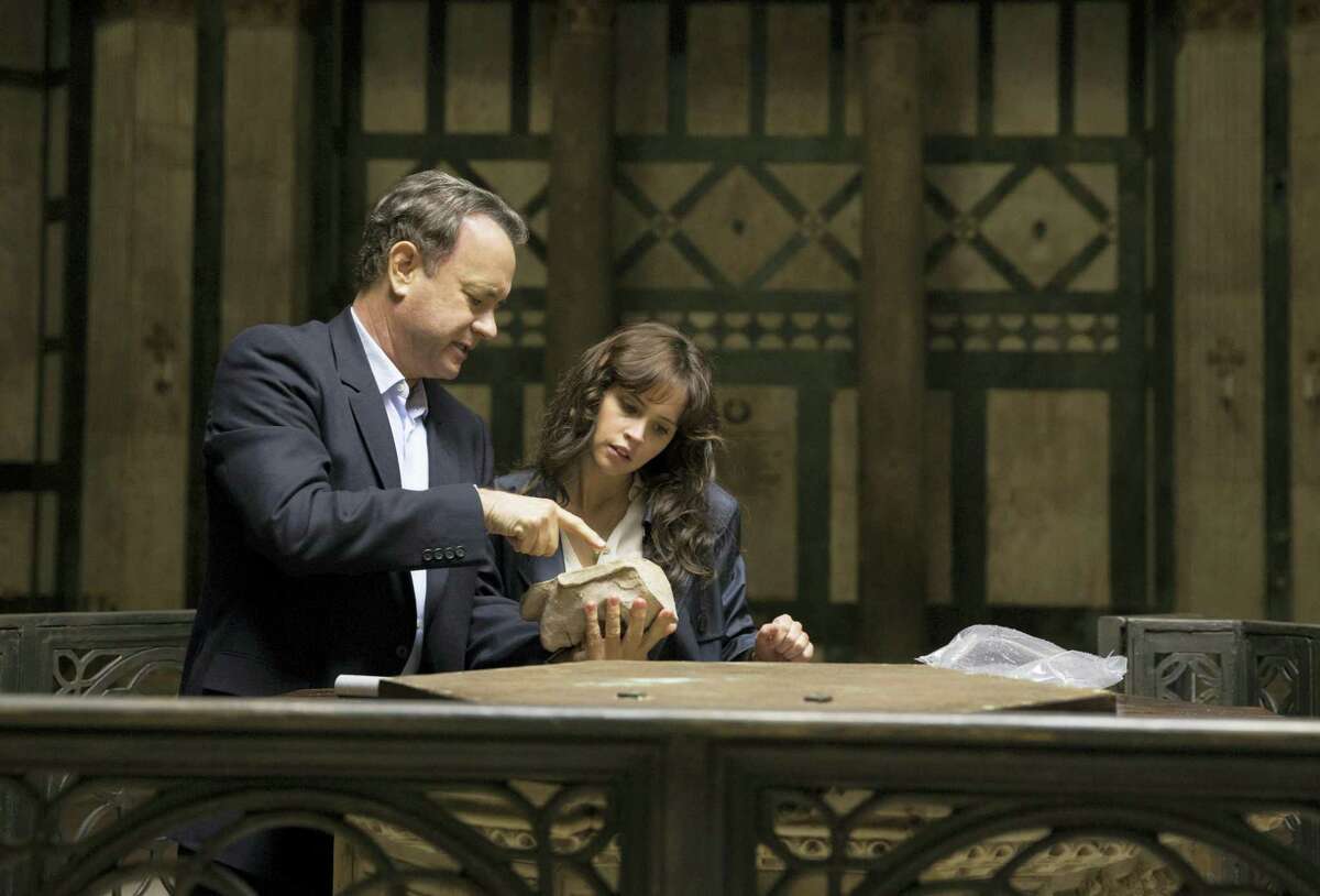In this file image released by Sony Pictures, Tom Hanks, left, and Felicity Jones appear in a scene from, “Inferno.” Tom Hanks and Ron Howard’s latest Dan Brown adaptation, “Inferno,” went up in flames at the weekend box office, allowing Tyler Perry’s “Boo! A Madea Halloween” a surprise victory.