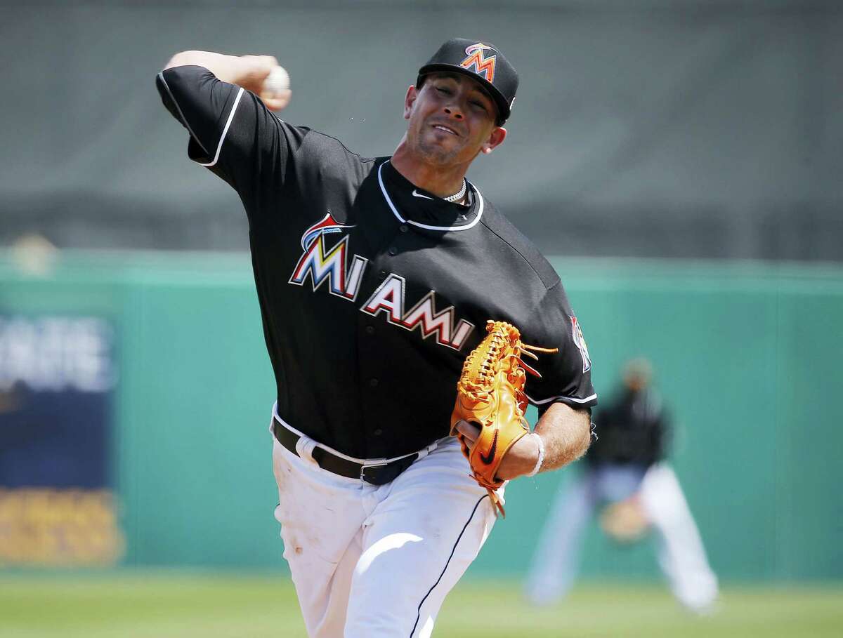 Miami Marlins starting pitcher Jose Fernandez delivers the ball during the first inning of an exhibition spring training baseball game against the New York Mets March 17, 2016 in Jupiter, Fla.