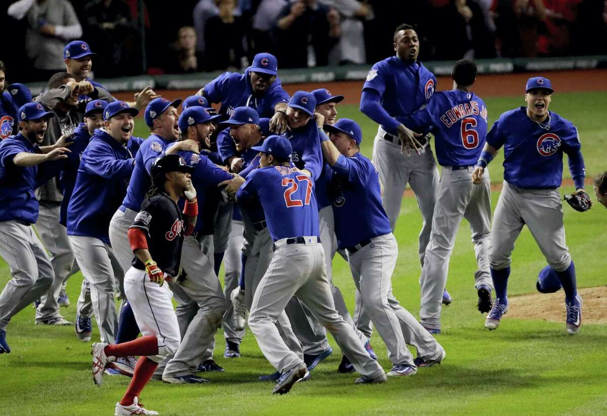 The Chicago Cubs celebrate after Game 7 of the World Series in Cleveland. The Cubs won 8-7 in 10 innings to win the series 4-3 and clinch their first world championship since 1908.