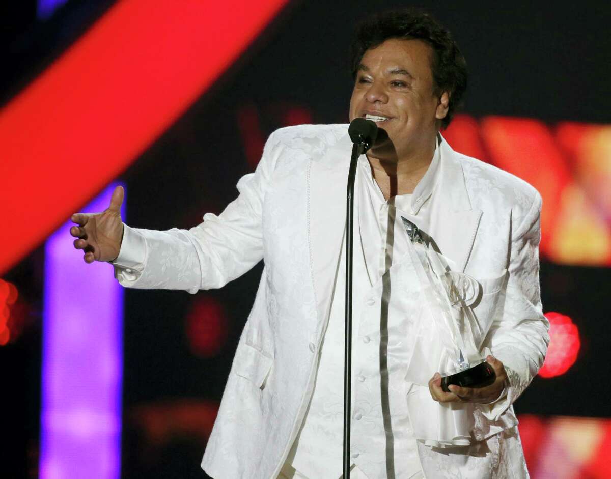 In this April 28, 2016 photo, singer Juan Gabriel receives the Star Award at the Latin Billboard Awards, in Coral Gables, Fla. Representatives of Juan Gabriel have reported Sunday, Aug. 28, 2016, that he has died. Gabriel was Mexico’s leading singer-songwriter and top-selling artist with sales of more than 100 million albums.