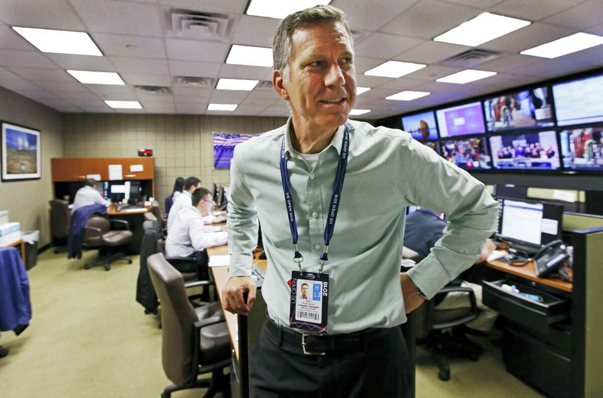In this Aug. 24, 2016 photo, U.S. Open Tennis Tournament Security director Michael Rodriguez stands inside the tournament’s command center inside the Billie Jean King National Tennis Center in New York. With more than 700,000 fans expected, the U.S. Open tennis tournament poses unique security challenges for officials charged with making the grounds safe. Rodriguez oversees a private security force.