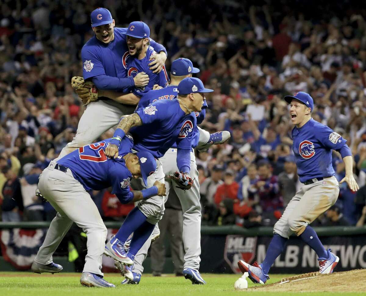 Members of the Chicago Cubs celebrate after winning Game 7 of the World Series against the Indians on Thursday.