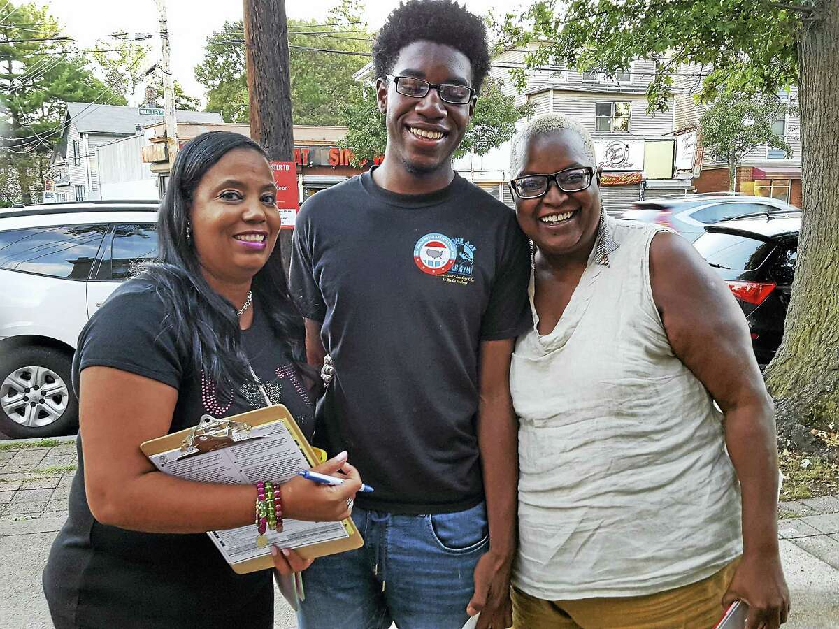 Greater New Haven NAACP branch President Doris Dumas, new voter Gregory Ivy, 18, and resident Babz Rawls Ivy