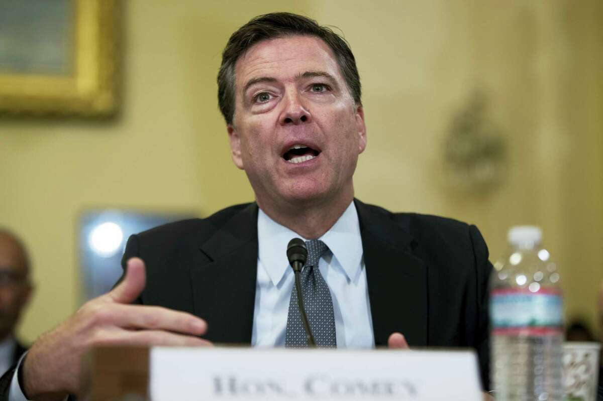 FBI Director James Comey testifies on Capitol Hill in Washington in July. The FBI informed Congress Friday, Oct. 28, 2016, it is investigating whether there is classified information in new emails that have emerged in its probe of Hillary Clinton’s private server. The FBI said in July its investigation was finished.
