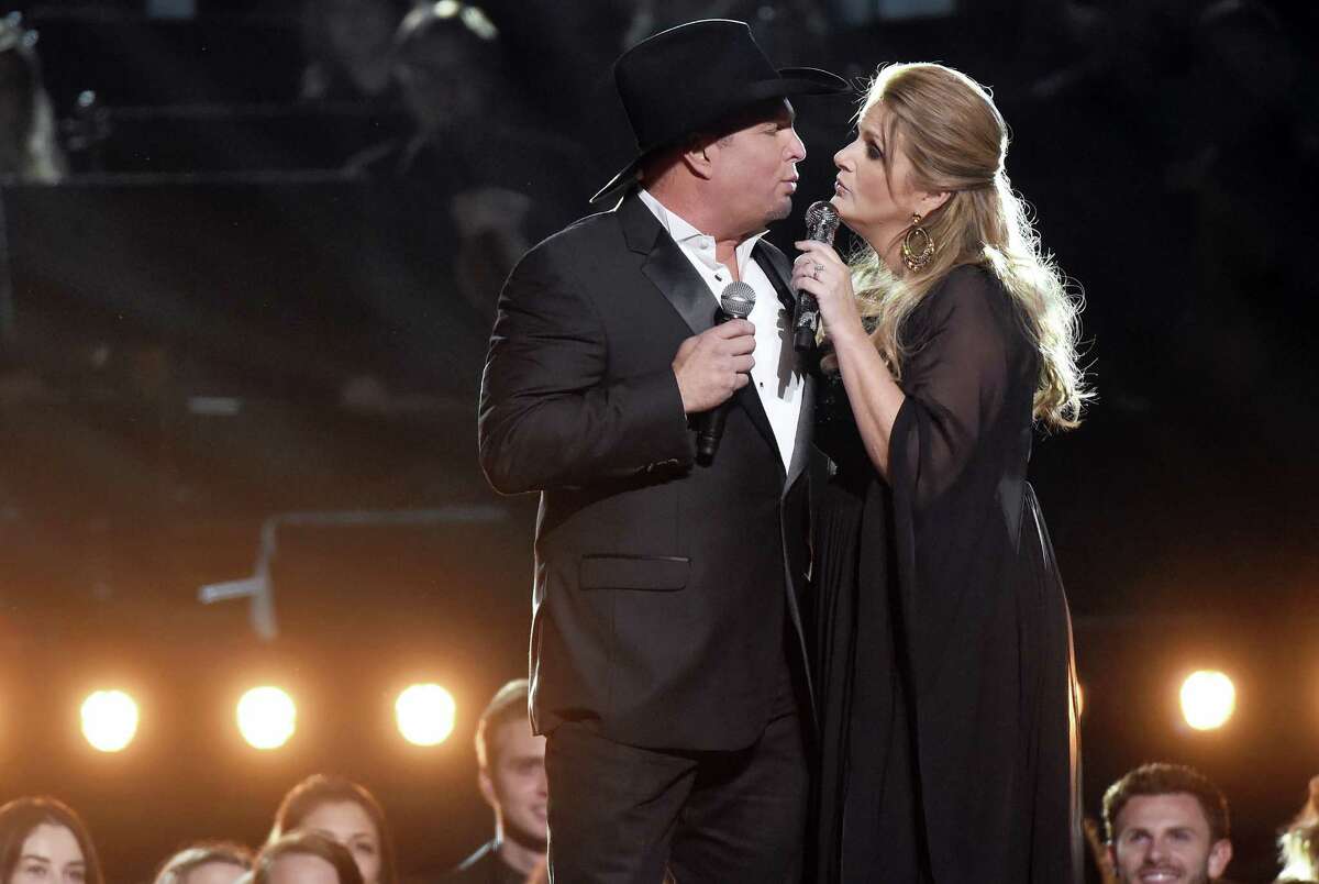 Garth Brooks, left, and Trisha Yearwood perform at the 50th annual CMA Awards at the Bridgestone Arena on Nov. 2, 2016 in Nashville, Tenn.
