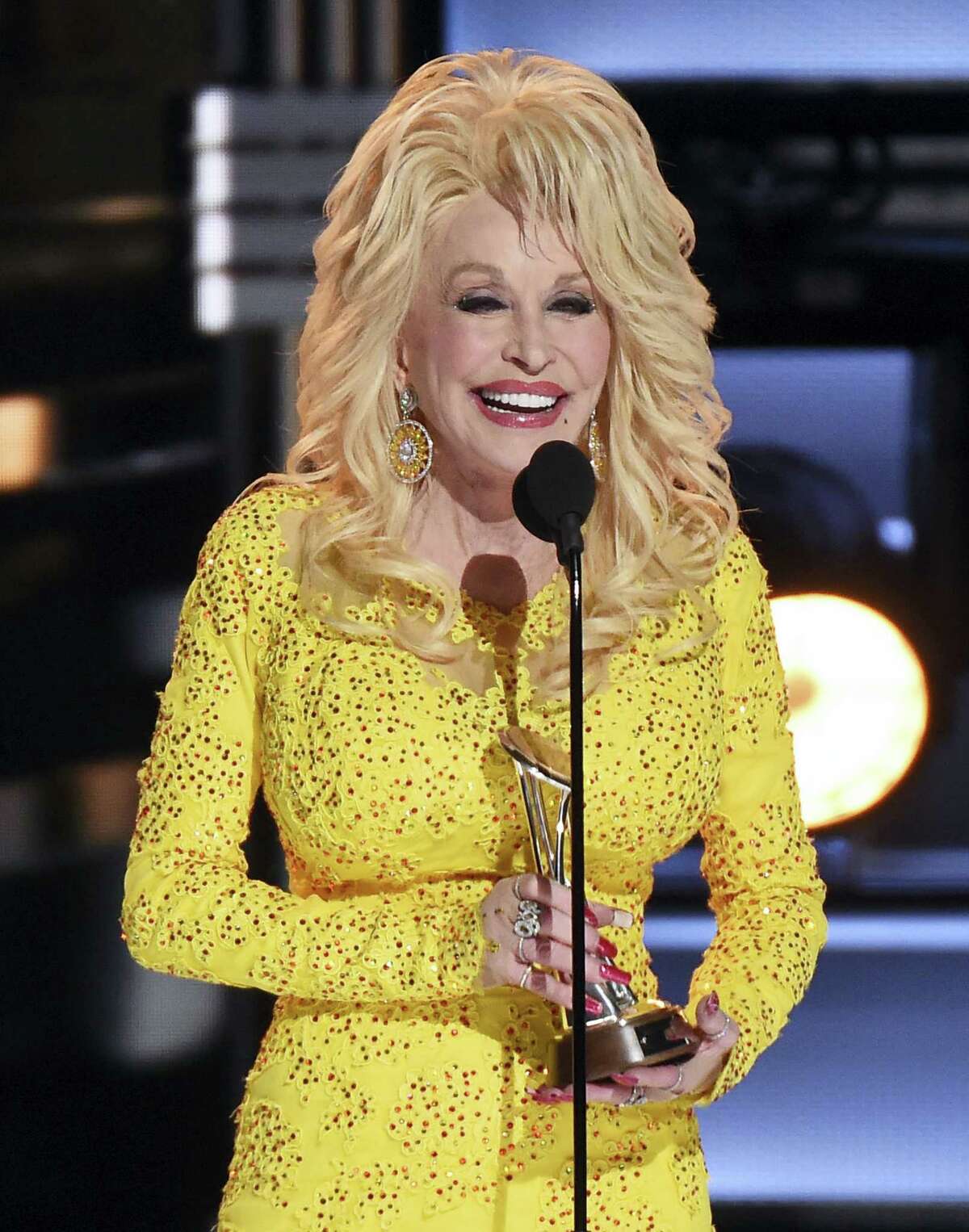Dolly Parton accepts the Willie Nelson Lifetime Achievement Award at the 50th annual CMA Awards at the Bridgestone Arena on Nov. 2, 2016 in Nashville, Tenn.