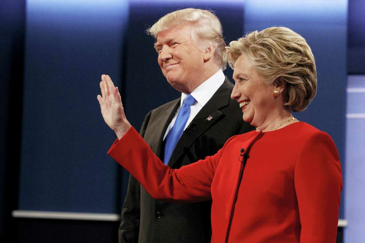 Republican presidential candidate Donald Trump, left, stands with Democratic presidential candidate Hillary Clinton before the first presidential debate at Hofstra University, Monday in Hempstead, N.Y.