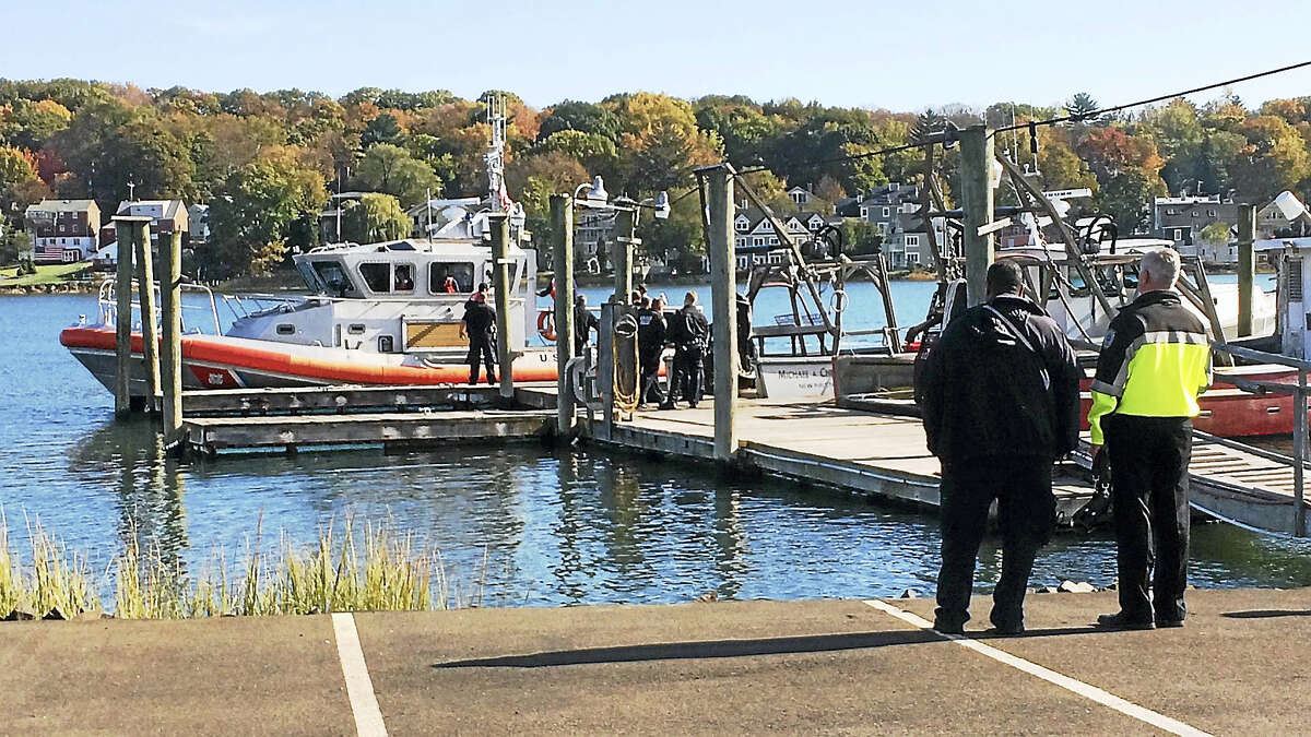 New Haven police investigate Tuesday after a man’s body was pulled from the Quinnipiac River.