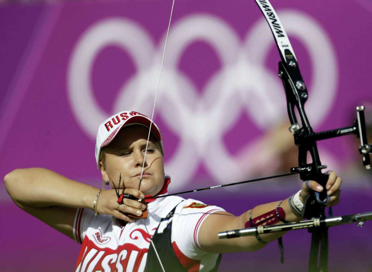 In this Aug. 2, 2012, file photo, Russia’s Ksenia Perova shoots during the individual archery competition at the 2012 Summer Olympics in London. The archery federation said Monday, July 25, 2016, it had approved the entry of three Russian archers after determining they have no links to doping. They were listed as Tuiana Dashidorzhieva, Ksenia Perova and Inna Stepanova.