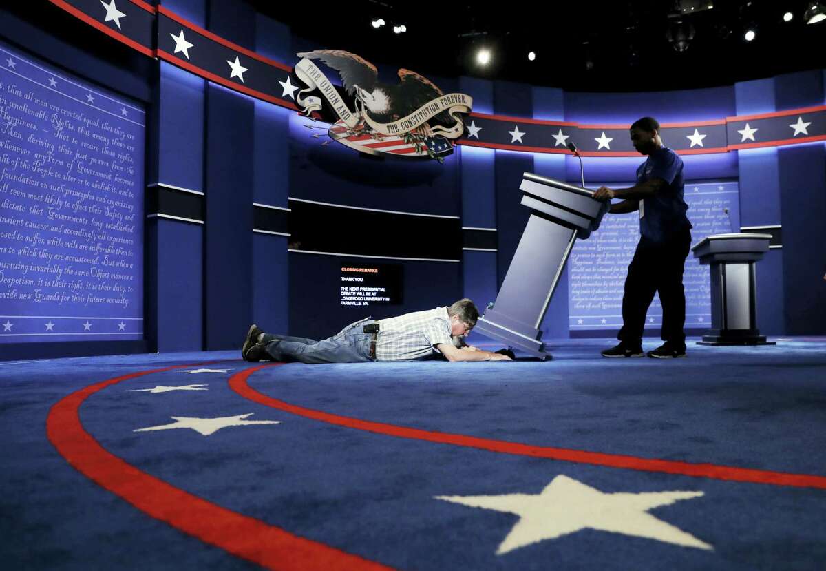 Technicians set up the stage for the presidential debate between Democratic presidential candidate Hillary Clinton and Republican presidential candidate Donald Trump at Hofstra University in Hempstead, N.Y. on Sept. 25, 2016.
