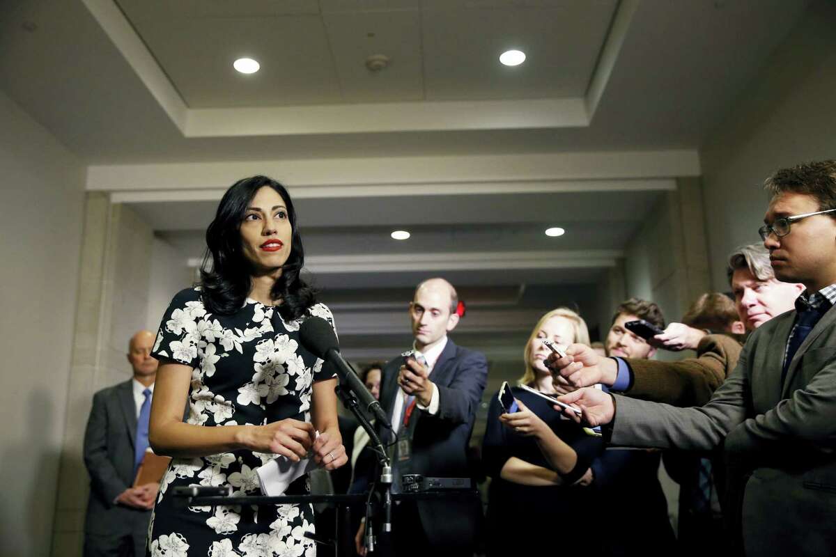 In this Oct., 16, 2015 file photo, Huma Abedin, a longtime aide to Hillary Rodham Clinton, speaks to the media after testifying at a closed-door hearing of the House Benghazi Committee, on Capitol Hill in Washington. The longtime Hillary Clinton aide at the center of a renewed FBI email investigation testified under oath four months ago she never deleted old emails, despite promising in 2013 not to take sensitive files when she left the State Department.