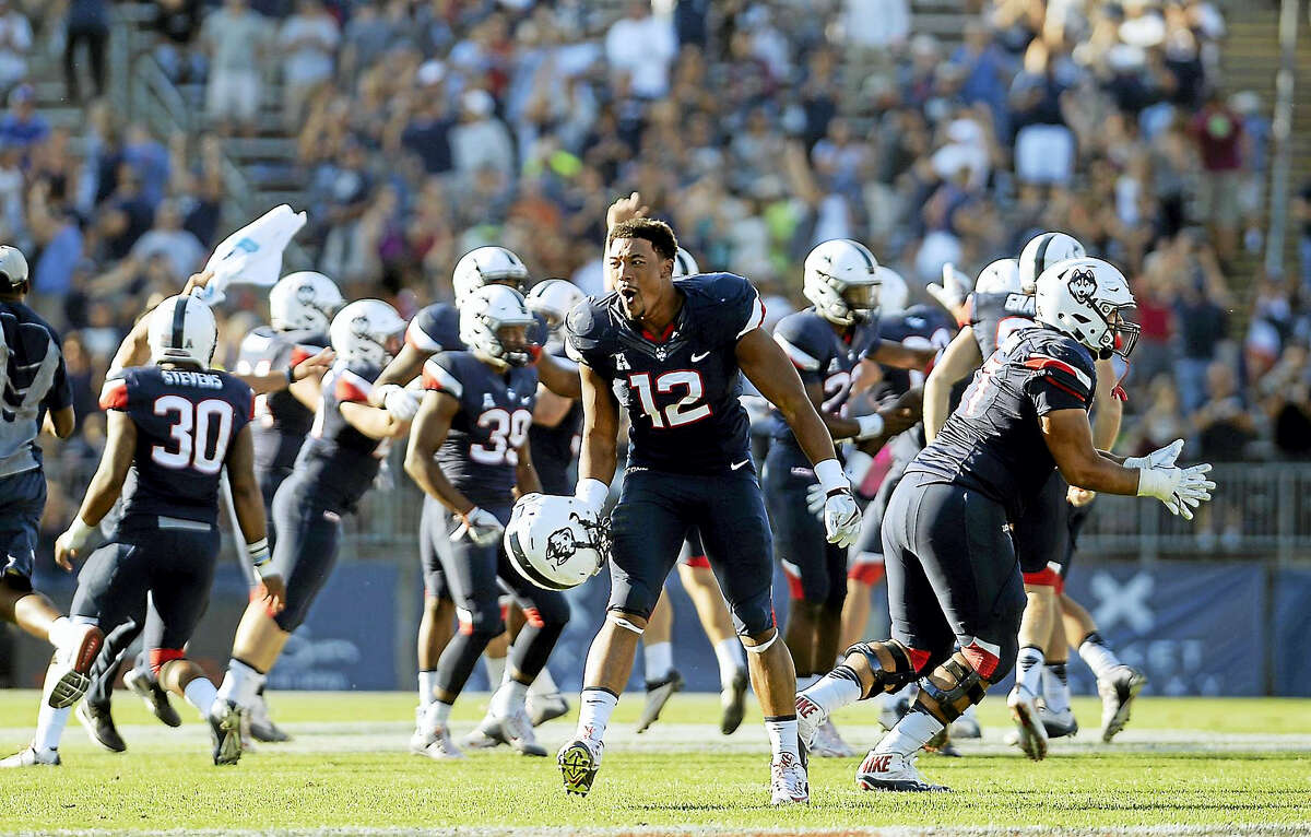 UConn’s E.J. Levenberry (12) celebrates after the Huskies win over Virginia on Sept. 17.