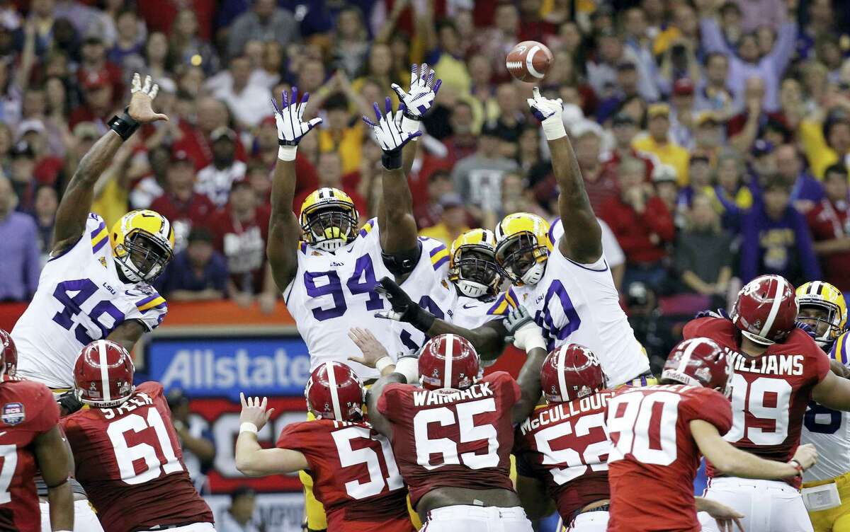 In this file photo, Alabama’s Jeremy Shelley (90) has a field goal blocked by SEC rival LSU.