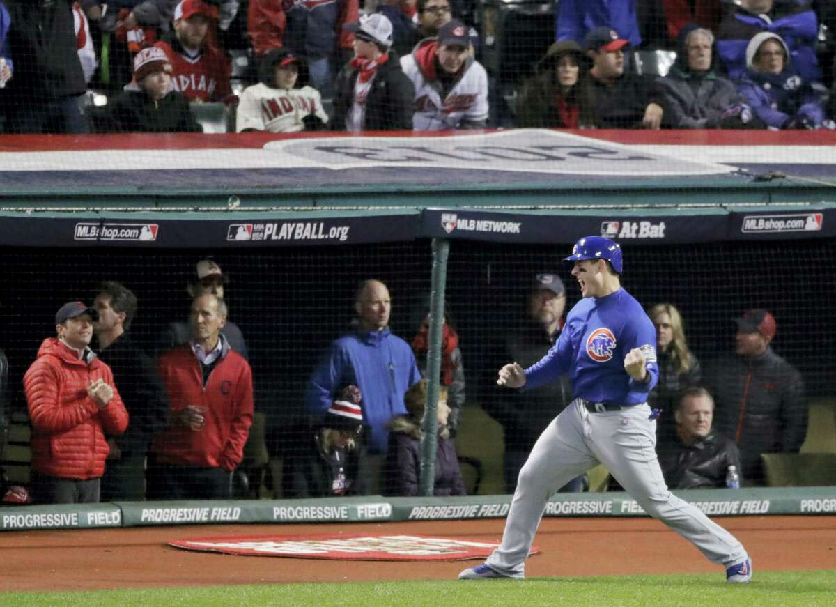 Chicago’s Anthony Rizzo celebrates after scoring on a hit by Ben Zobrist during the fifth inning of Game 2.