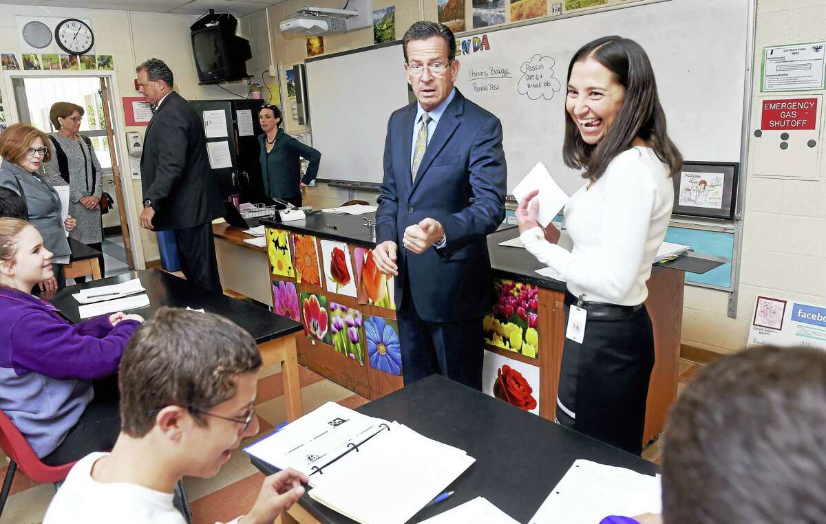 Gov. Dannel P. Malloy, center, meets with 2017 Connecticut Teacher of the Year Lauren Danner, right, in her tenth-grade biology class at North Branford High School Tuesday.