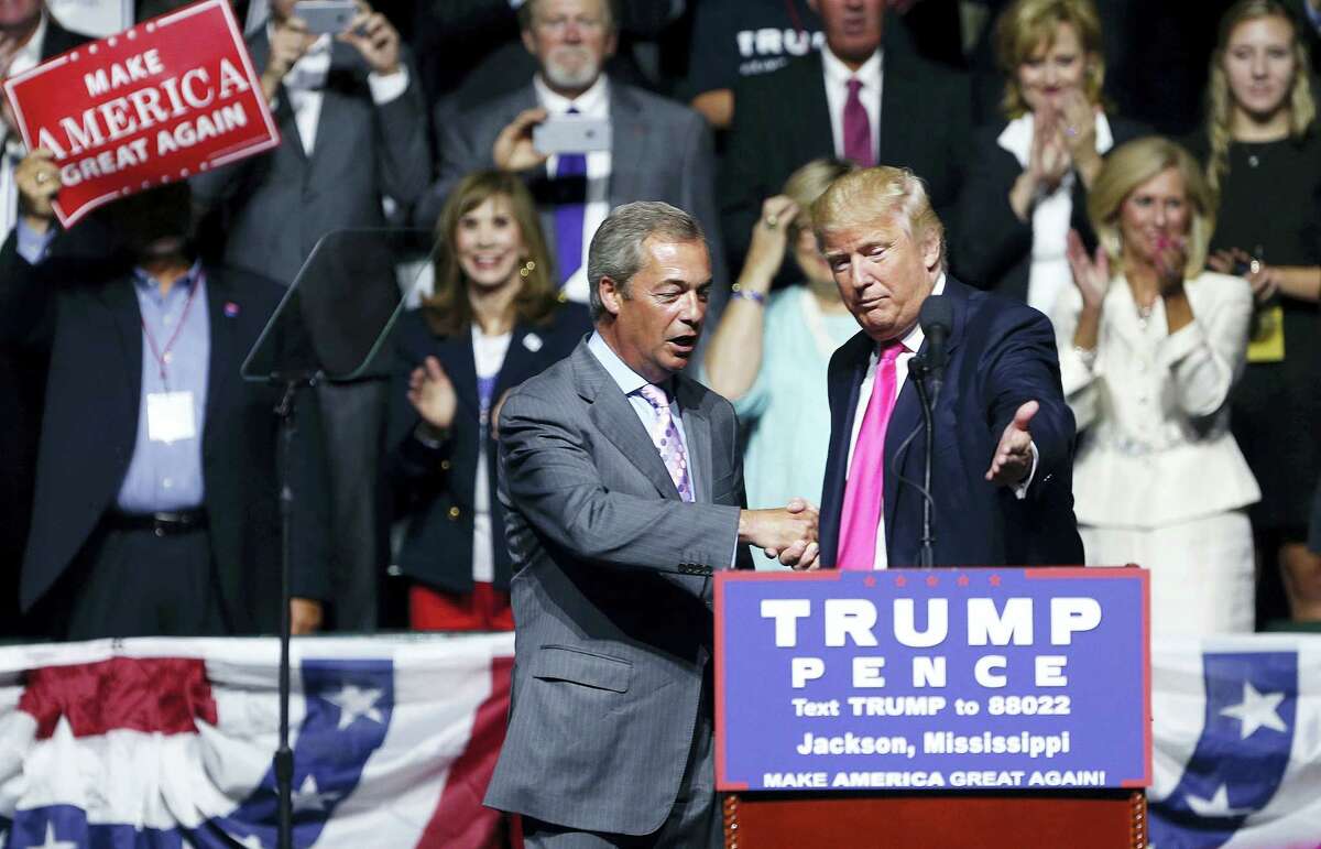 Republican presidential candidate Donald Trump welcomes Nigel Farage, ex-leader of the British UKIP party, to speak at a campaign rally in Jackson, Miss., Wednesday, Aug. 24, 2016.
