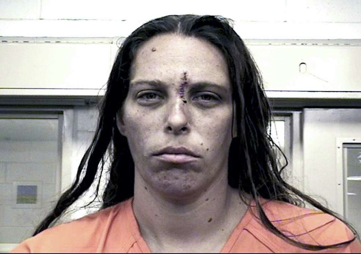This Aug. 25, 2016, booking photo provided by the Metropolitan Detention Center shows Michelle Martens. New Mexico Gov. Susana Martinez says what happened to the little girl “is unspeakable and justice should come down like a hammer” on whoever is responsible. Officer Tanner Tixier said in a news release Wednesday, Aug. 24, that charges are being filed against Martens, Fabian Gonzales, and Jessica Kelley.