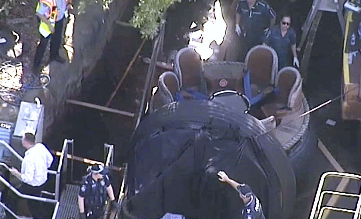 In this image made from video, rescue personnel stand by the Thunder River Rapids ride at Dreamworld on the Gold Coast, Australia, Tuesday, Oct. 25, 2016. Four people died after a malfunction caused two people to be ejected from their raft, while two others were caught inside the ride at the popular theme park on Australia’s east coast.