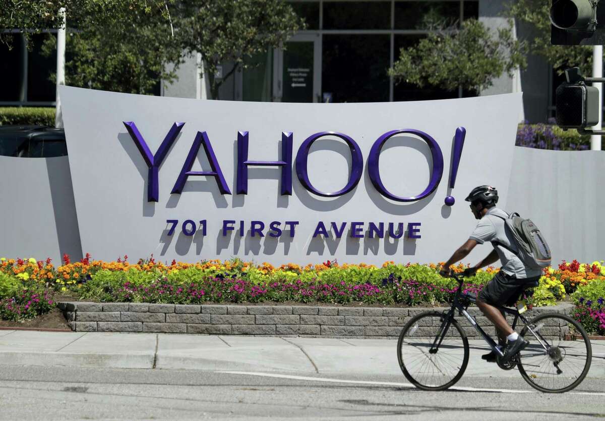 A cyclist rides past a Yahoo sign at the company’s headquarters in Sunnyvale, Calif. The Yahoo hack announced Wednesday, Dec. 14, 2016 exposed personal details from more than 1 billion user accounts, potentially the largest breach of an email provider in history.