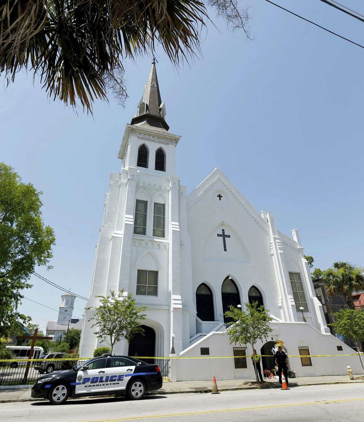 Two Charleston police officers stand in front of the Emanuel AME Church in 2015, following a shooting.
