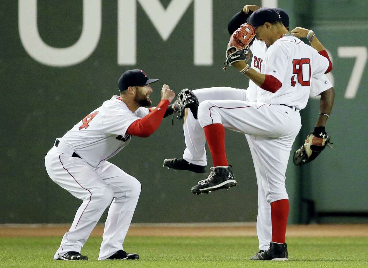 Red Sox outfielder Bryce Brentz, left, celebrates with Mookie Betts (50) and Jackie Bradley Jr. after beating the Twins 13-2 on Thursday.