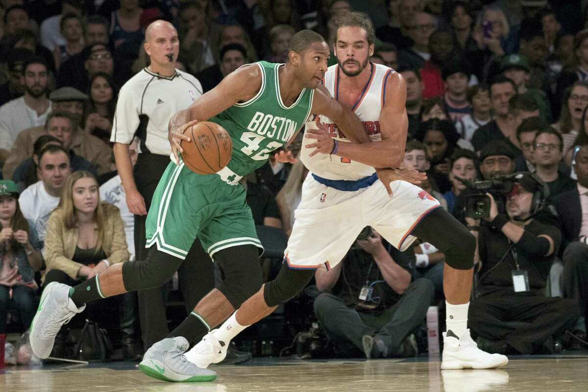 Celtics center Al Horford (42) drives to the basket during a preseason game against the Knicks.