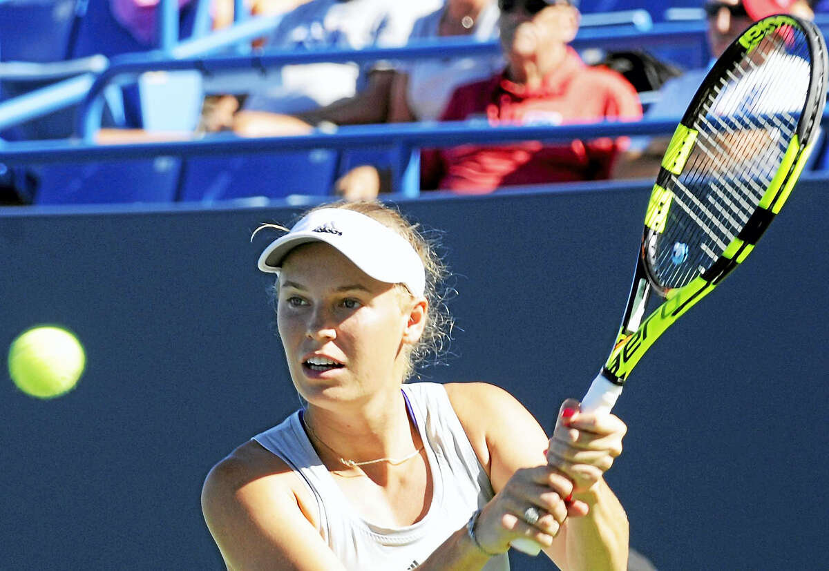 Caroline Wozniacki hits a return during her match against Jelena Ostapenko at the Connecticut Open on Monday.