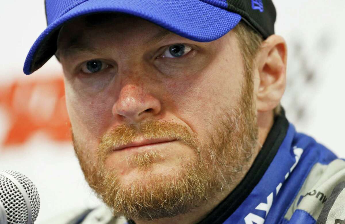 In this April 1, 2016 photo, Sprint Cup driver Dale Earnhardt Jr., speaks to the media during a press conference at the Martinsville Speedway in Martinsville, Va.