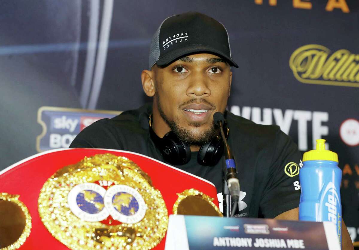 Britain’s Anthony Joshua speaks during a press conference in Manchester, England on Dec. 8, 2016 ahead of his IBF world heavyweight fight against U.S fighter Eric Molina in Manchester on Saturday.
