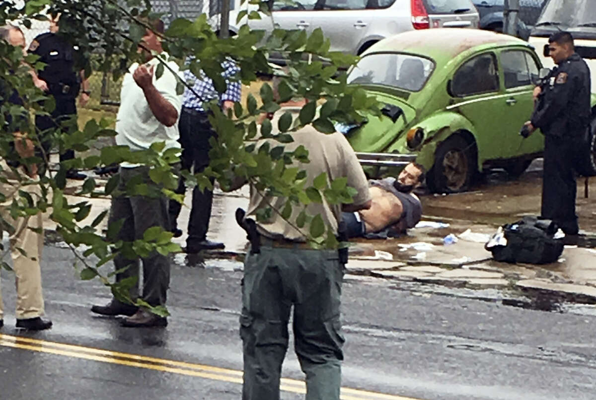 Ahmad Khan Rahami is taken into custody after a shootout with police on Sept. 19, 2016 in Linden, N.J. Rahami was wanted for questioning in the bombings that rocked the Chelsea neighborhood of New York and the New Jersey shore town of Seaside Park.