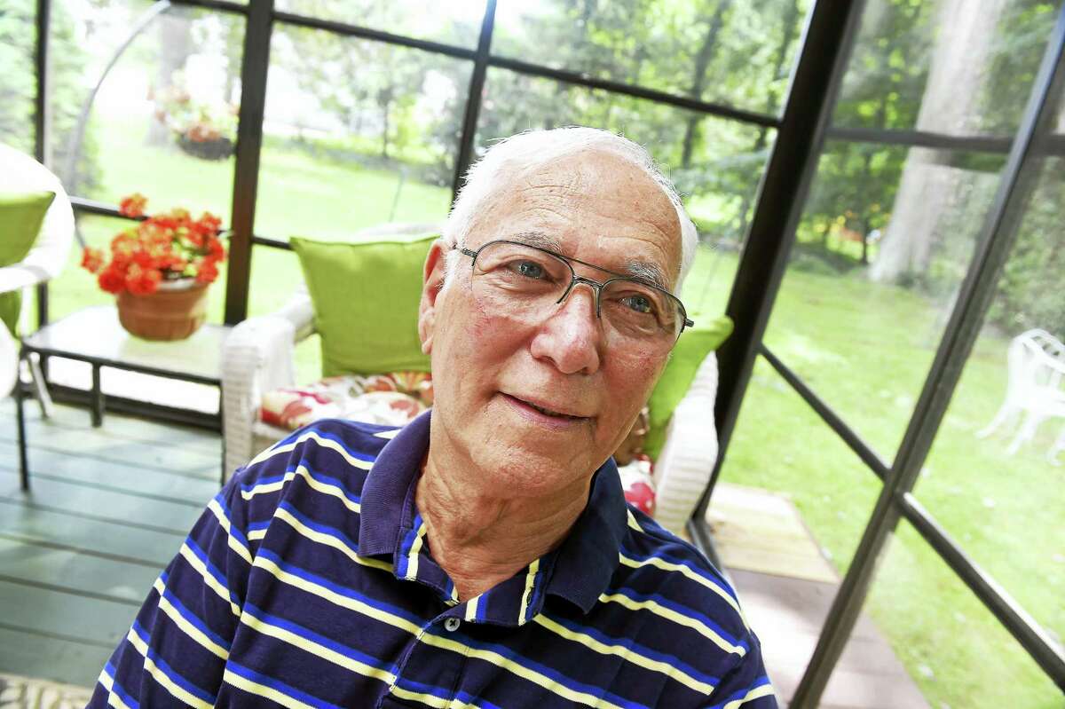 Kidney recipient Nathan Smith of Orange is photographed on his backyard deck.