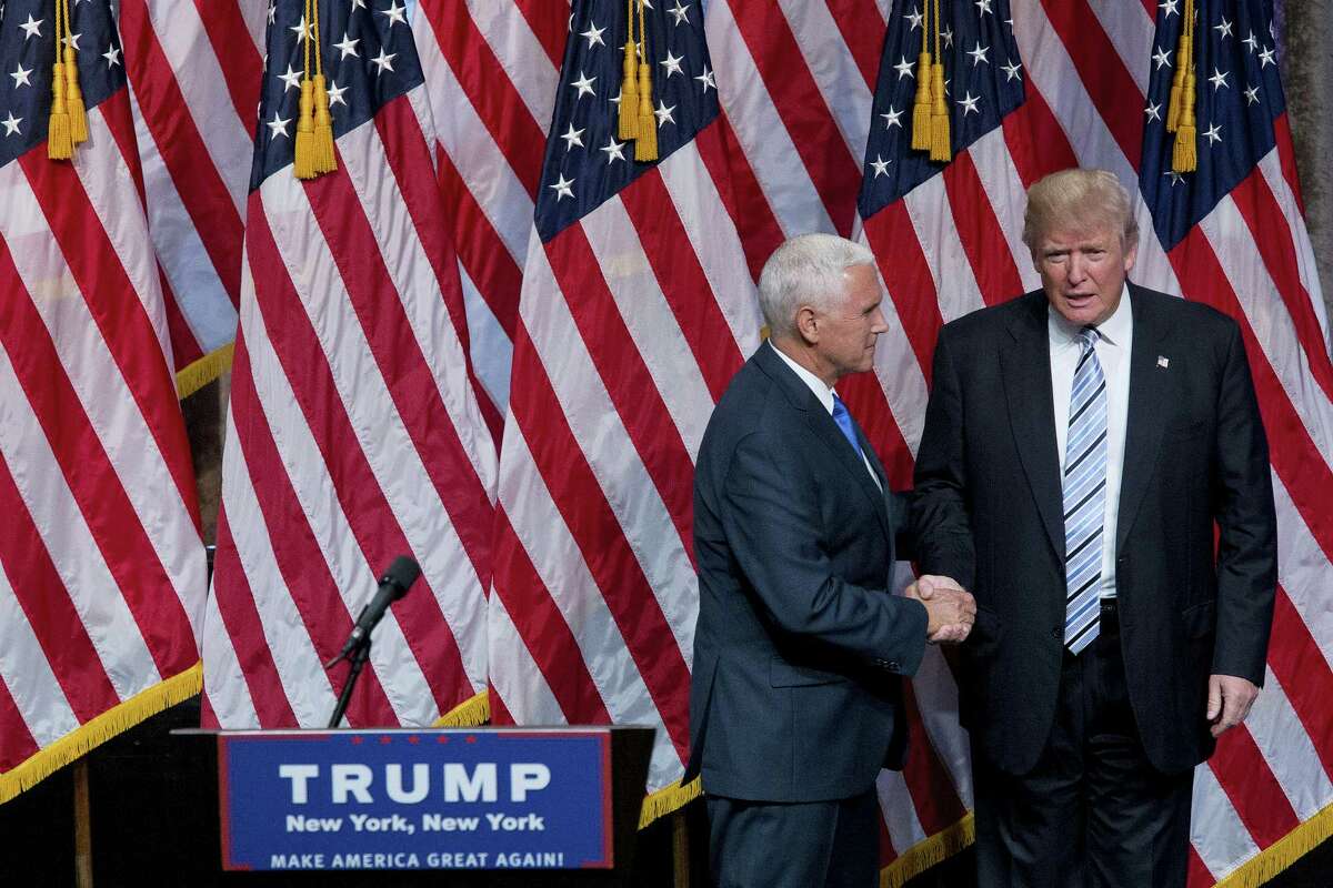 Republican presidential candidate Donald Trump, right, and Gov. Mike Pence, R-Ind., shake hands during a campaign event to announce Pence as the vice presidential running mate on, Saturday, July 16, 2016, in New York. In their first joint appearance, Trump tried to draw a sharp contrast between Pence, a soft-spoken conservative, and Hillary Clinton, the Democratic presidential candidate.