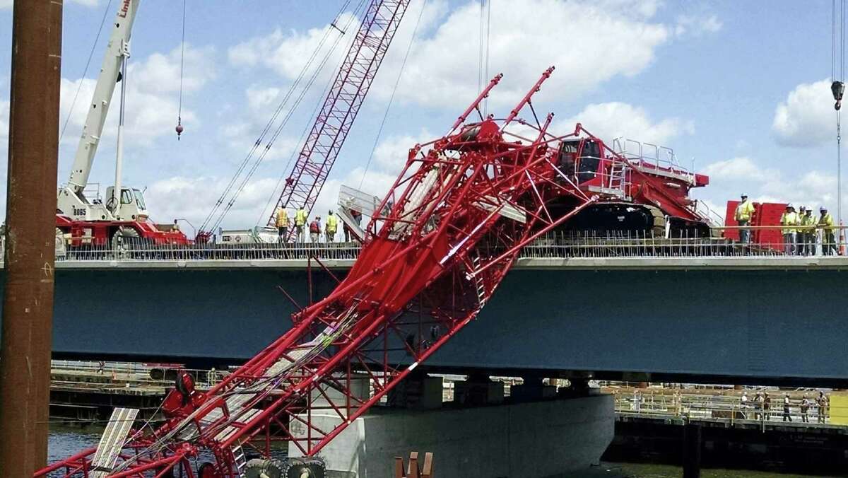A giant crane sits on the Tappan Zee Bridge north of New York City after toppling around noon Tuesday during construction of a new bridge, across the Hudson River between Westchester and Rockland counties.