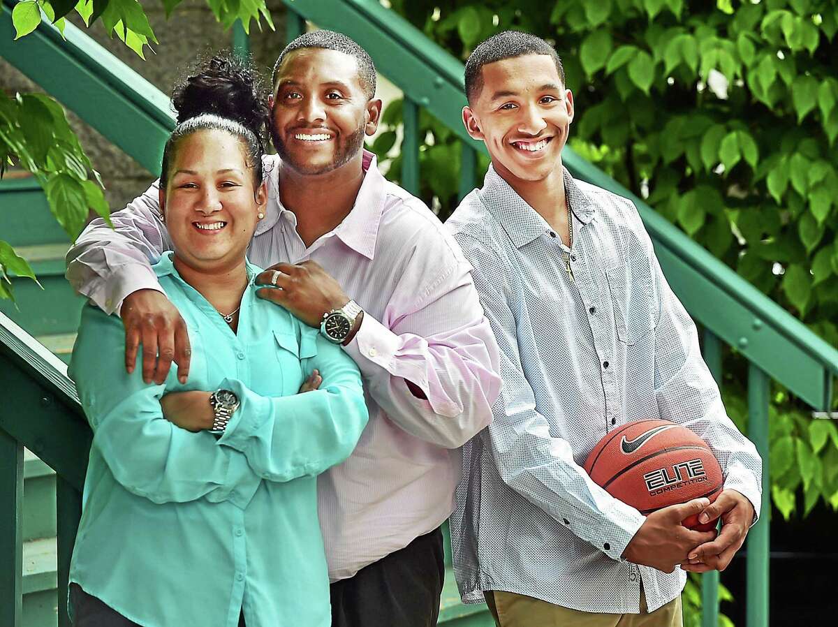 (Catherine Avalone - New Haven Register) Vanessa, Edward, and Tremont Waters, 17, of New Haven.