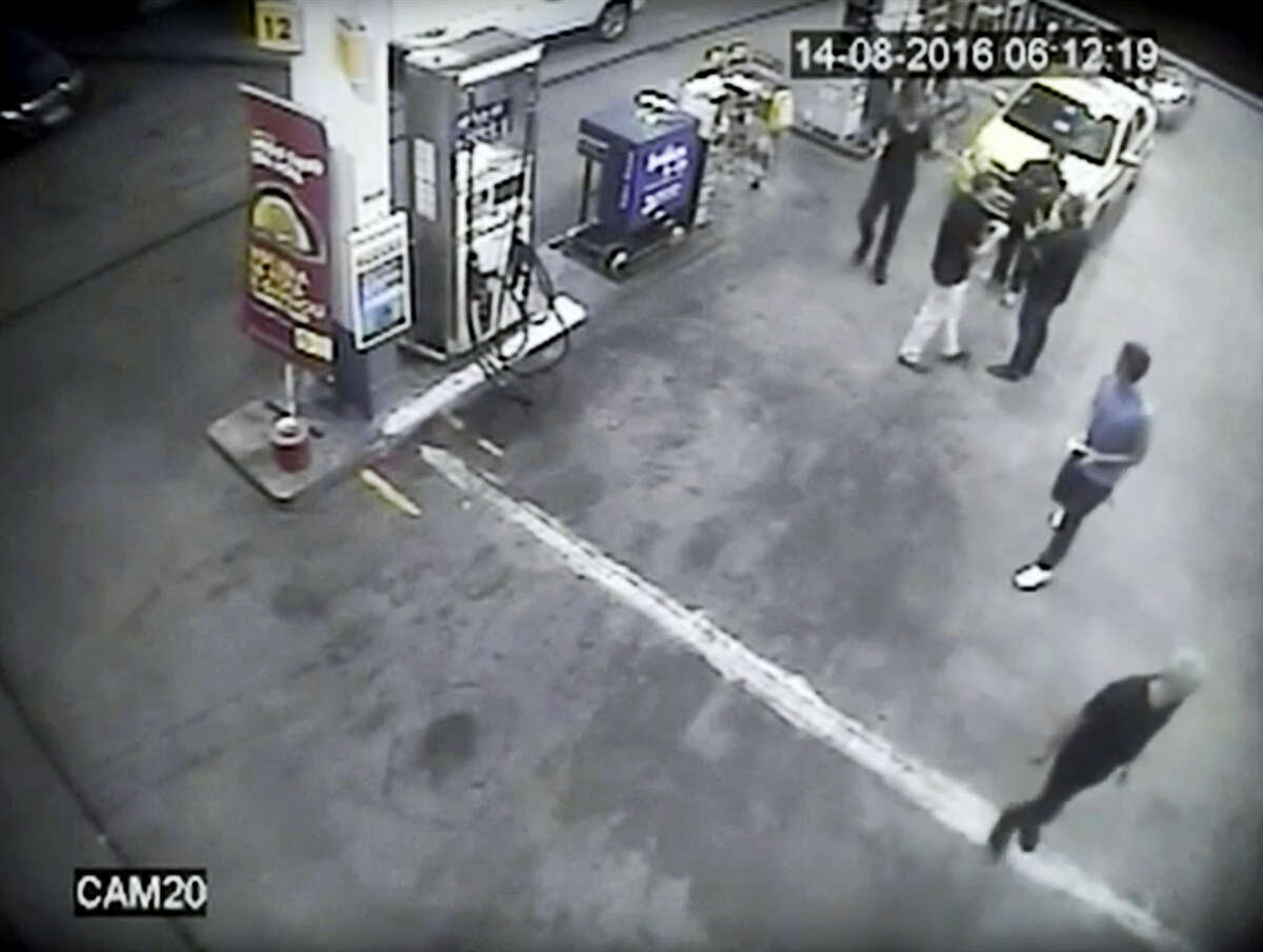 In this Sunday, Aug. 14, 2016, frame from surveillance video released by Brazil police, swimmers from the US Olympic team appear with Ryan Lochte, right, at a gas station during the 2016 Summer Olympics in Rio de Janeiro, Brazil. A top Brazil police official said the swimmers damaged property at the gas station.