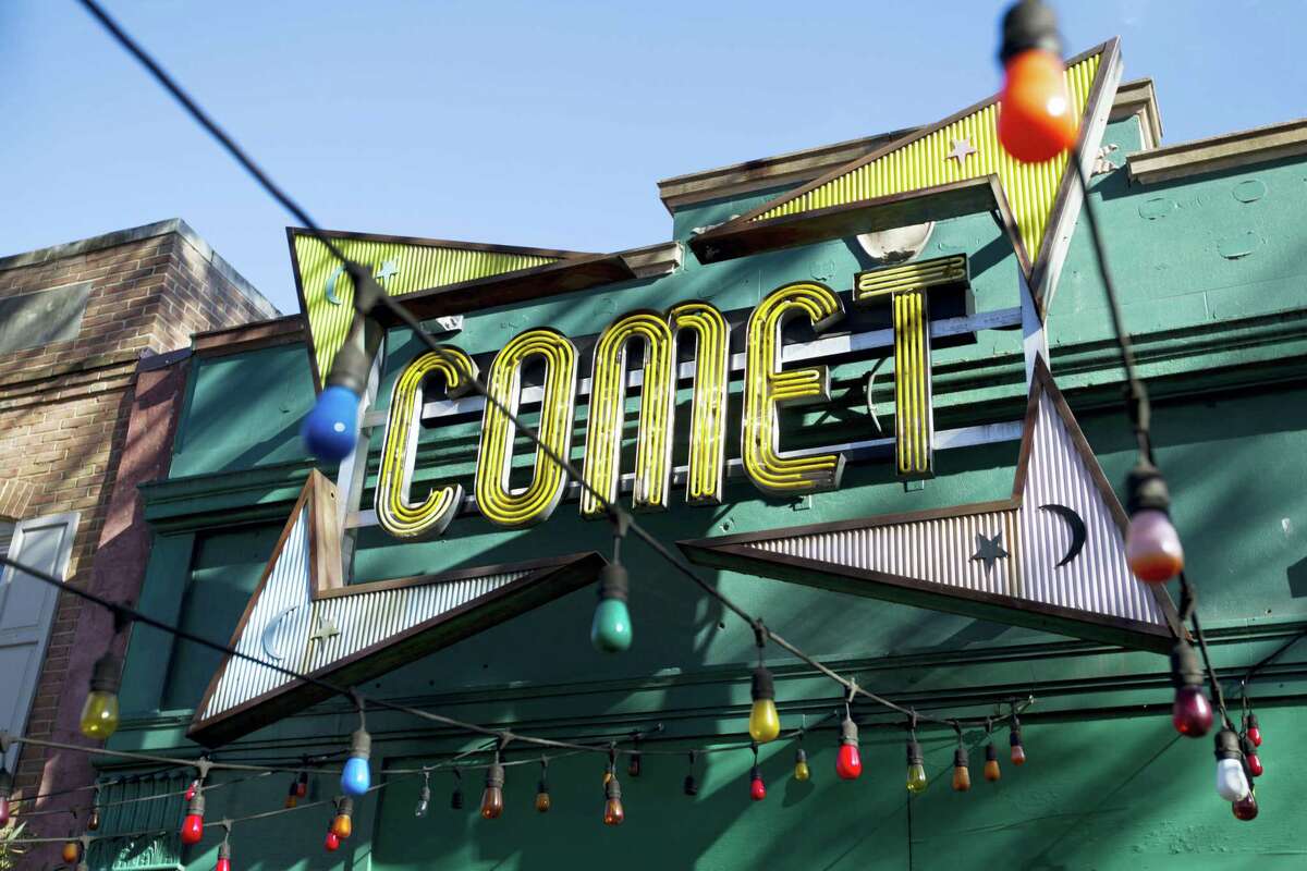 The front door of Comet Ping Pong pizza shop in Washington. A fake news story prompted a man to fire a rifle inside a popular Washington, D.C., pizza place as he attempted to “self-investigate” a conspiracy theory that Hillary Clinton was running a child sex ring from there, police said.