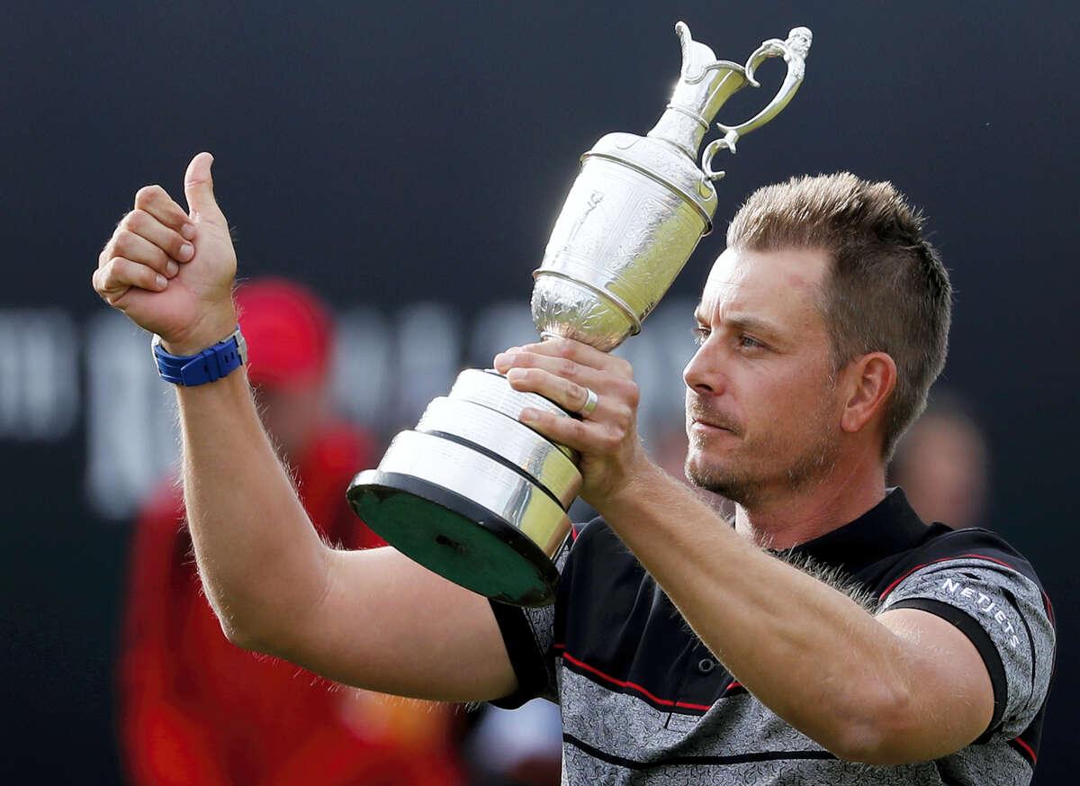 Henrik Stenson holds up the trophy after winning the British Open at the Royal Troon Golf Club in Troon, Scotland on Sunday.