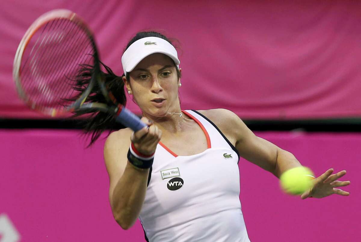 Christina Mchale of the United States returns a shot to Victoria Golubic of Switzerland during their quarter-final match of the Japan Women’s Open tennis tournament in Tokyo on Sept. 16, 2016.