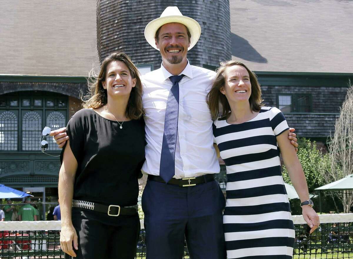 From left, Amelie Mauresmo, Marat Safin, and Justine Henin pose for photos during the enshrinement ceremony at the International Tennis Hall of Fame on Saturday in Newport, R.I.