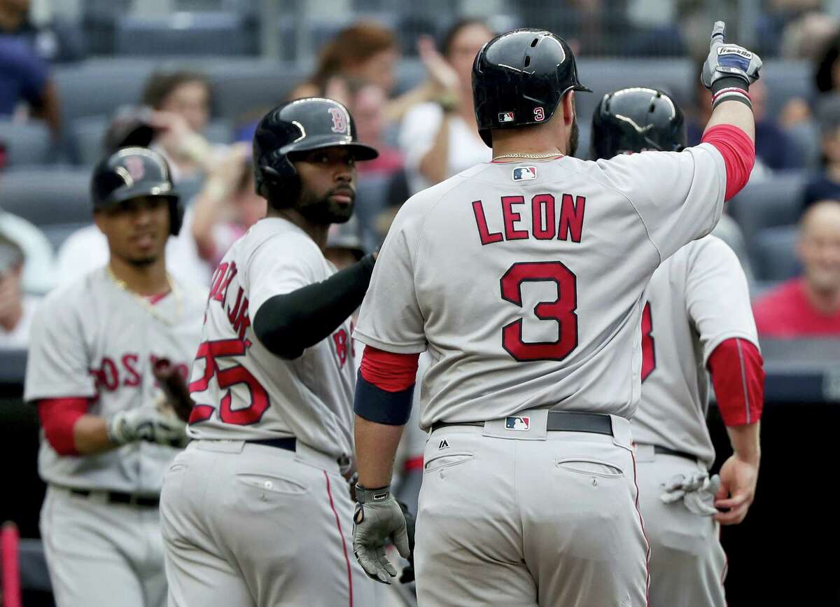 Sandy Leon (3) gestures as he heads to the dugout after hitting a three-run home run in the sixth inning Saturday.