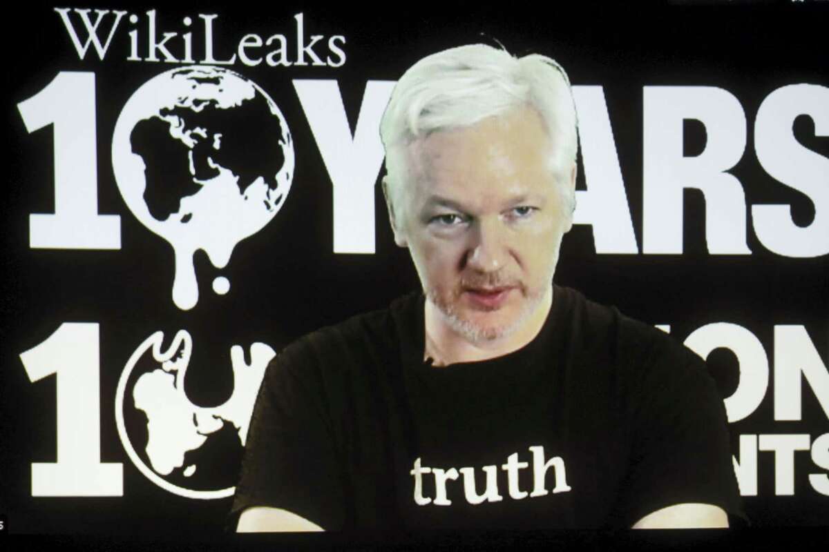 FILE - In this Oct. 4, 2016 file photo, WikiLeaks founder Julian Assange participates via video link at a news conference marking the 10th anniversary of the secrecy-spilling group in Berlin. WikiLeaks said on Monday, Oct. 17, 2016, that Assange’s internet access has been cut by an unidentified state actor.