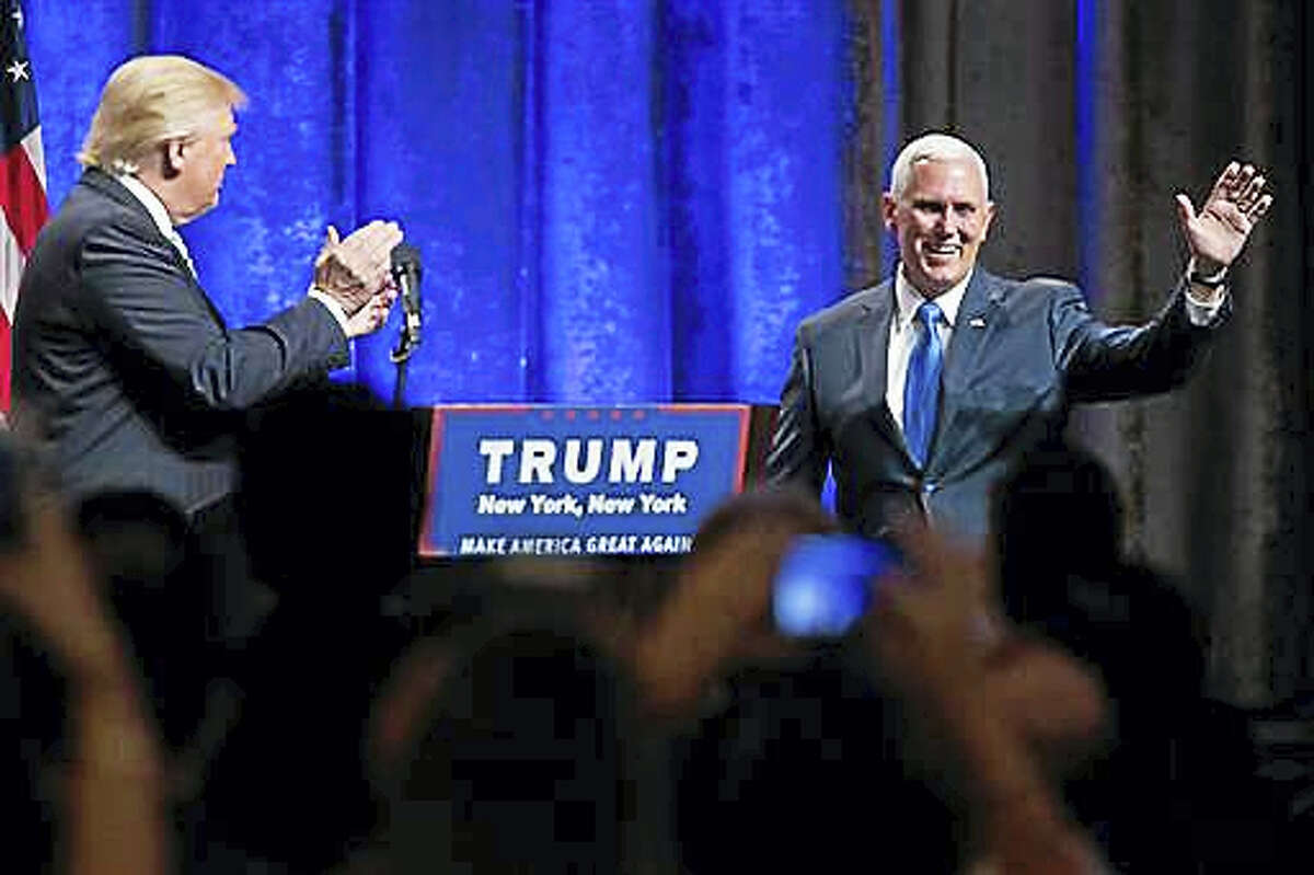 Republican presidential candidate Donald Trump, left, introduces Gov. Mike Pence, R-Ind., during a campaign event to announce Pence as the vice presidential running mate on, Saturday, July 16, 2016, in New York. Trump called Pence “my partner in this campaign” and his first and best choice to join him on a winning Republican presidential ticket.