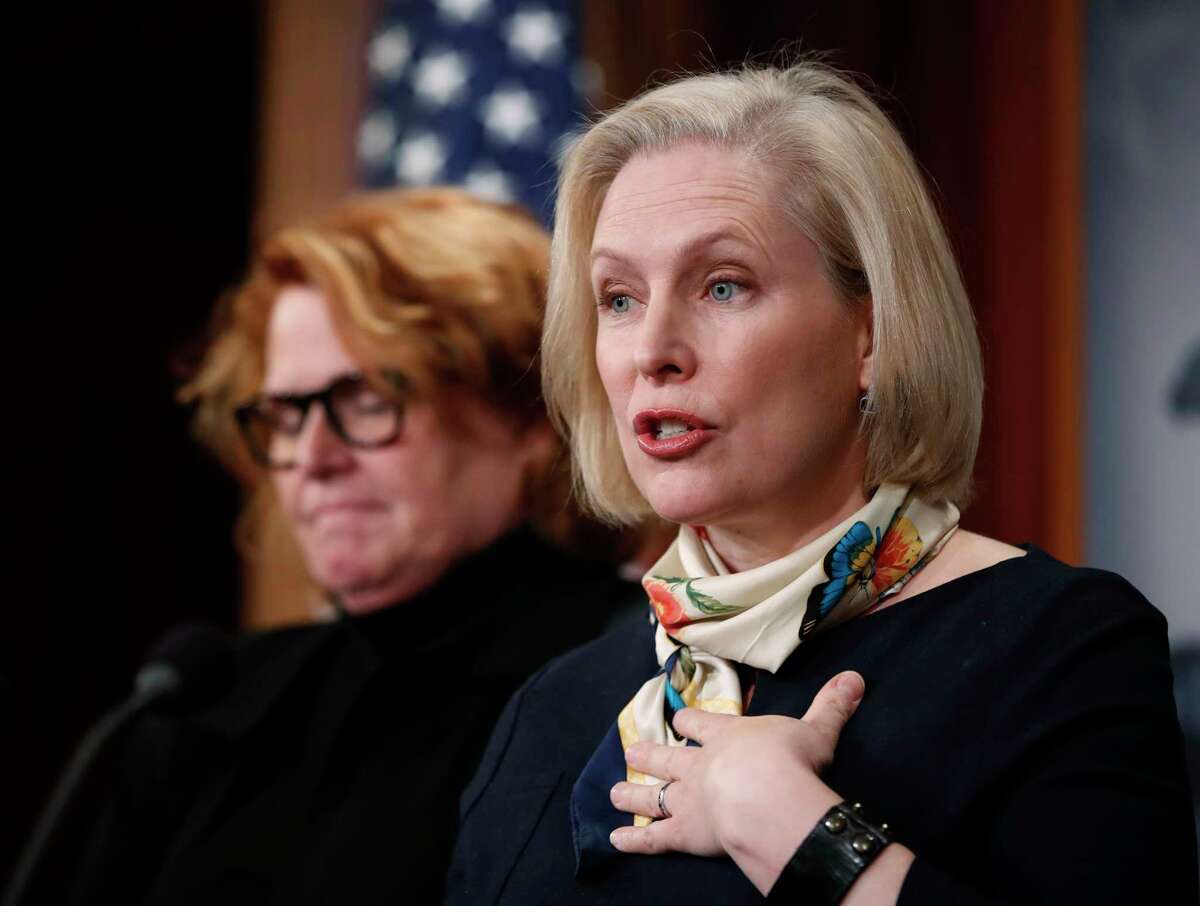 Sen. Kirsten Gillibrand, D-N.Y., right, accompanied by Sen. Heidi Heitkamp, D-N.D., speaks to reporters during a news conference about the Family Act, Tuesday, March 14, 2017, on Capitol Hill in Washington. (AP Photo/Manuel Balce Ceneta) ORG XMIT: DCMC102