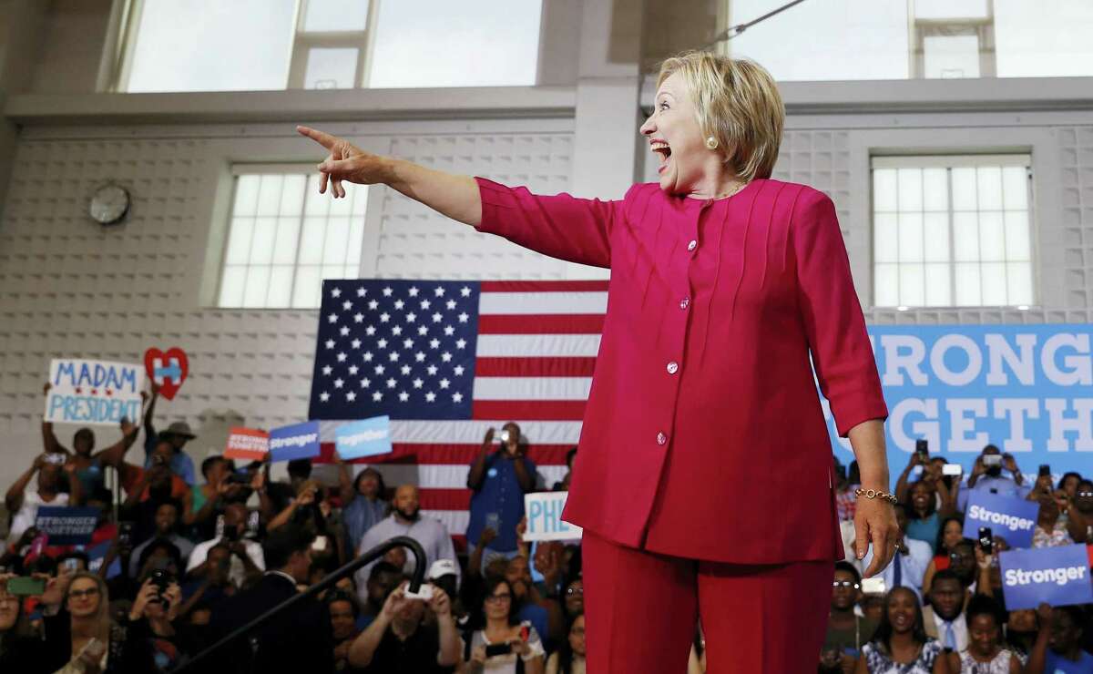 Democratic presidential candidate Hillary Clinton reacts to the cheering crowd as she arrives at a Pennsylvania Democratic Party voter registration event at West Philadelphia High School in Philadelphia on Aug. 16, 2016.