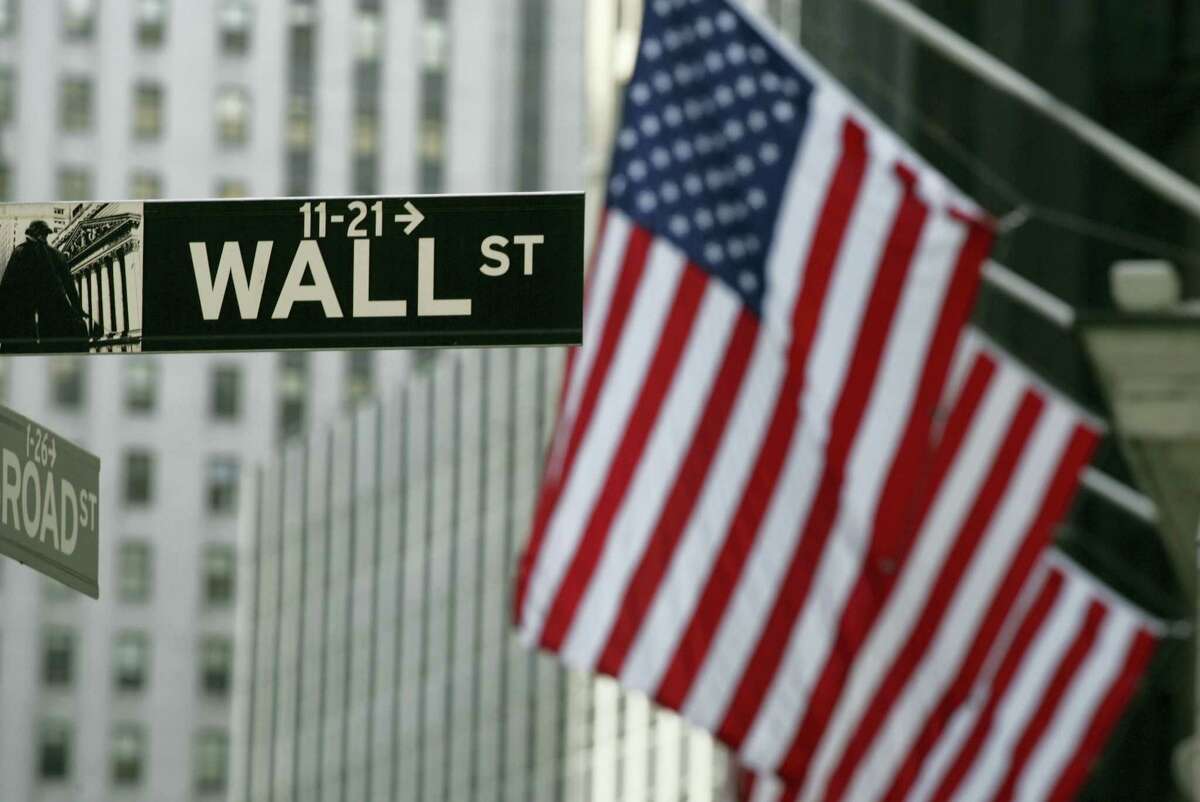 FILE - In this Sept. 17, 2008 file photo, a Wall Street sign is shown in New York. Stocks are rising modestly in early morning trading Friday, July 15, 2016 as the market extends a winning streak into a sixth day.